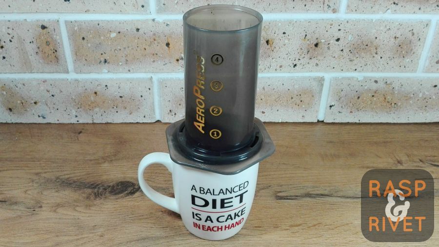 while the milk is heating, place the aeropress on a cup