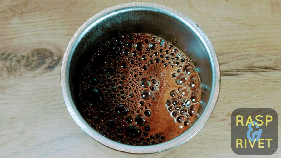 water added to the coffee inside the tumbler, before using the plunger