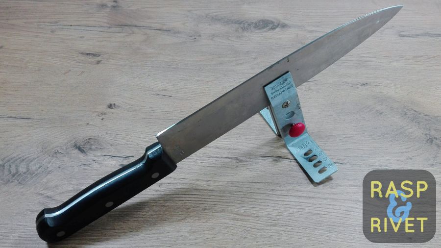 the chef's knife clamped in the lansky, ready to be sharpened