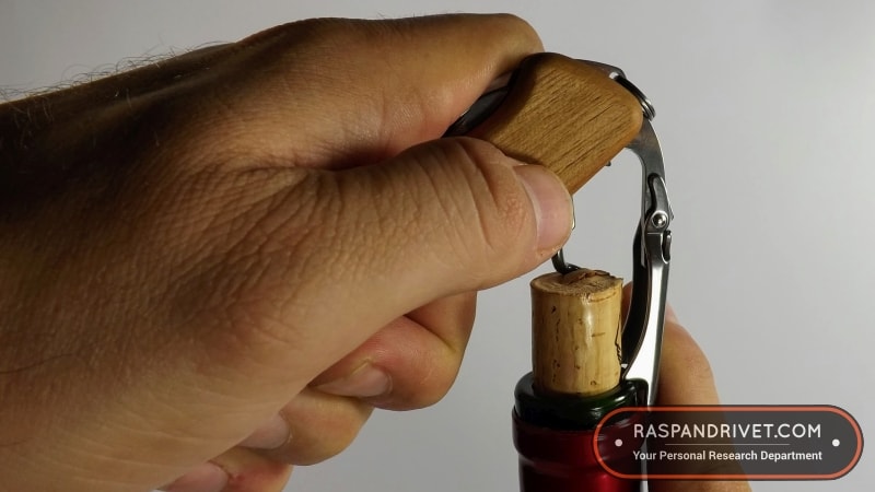 lever the cork out of the bottle by lifting the wine master by its handle