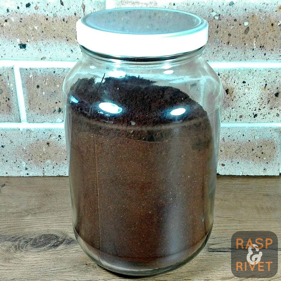A batch of coffee specifically ground for the AeroPress stored in a glass bottle.