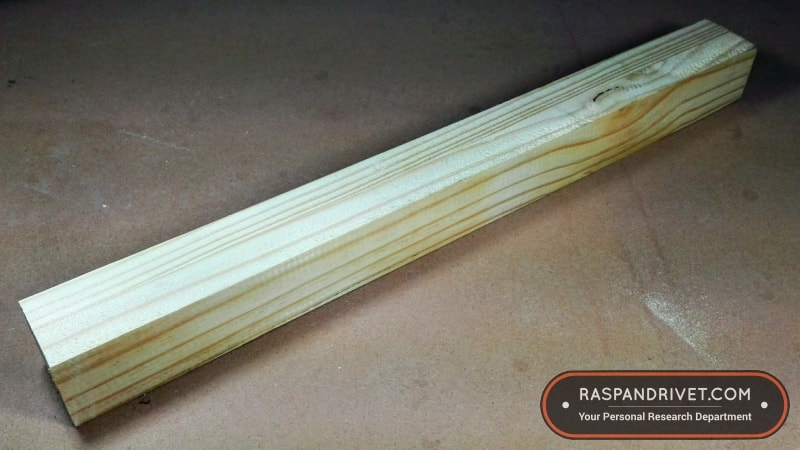 A length of square 40 mm pine wood. A length of square 40 mm pine wood.
