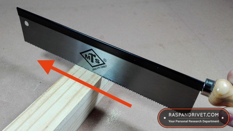 A western backsaw cuts on the forward stroke. A western backsaw cuts on the forward stroke.