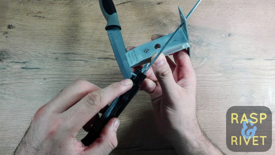 Lay the honing stone on the blade’s edge other side. Lay the honing stone on the blade's edge other side.