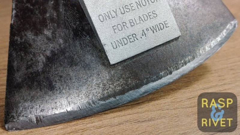 One side of the axe head after sharpening. One side of the axe head after sharpening.