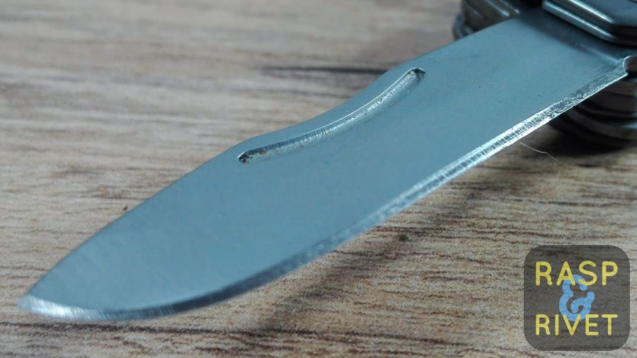 One side of the Gerber Mini multi tool’s blade before sharpening with the Lansky. One side of the Gerber Mini multi tool's blade before sharpening with the Lansky.