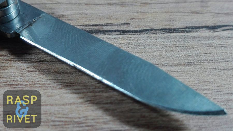 One side of the Leatherman Micra’s blade before sharpening with the Lansky. One side of the Leatherman Micra's blade before sharpening with the Lansky.