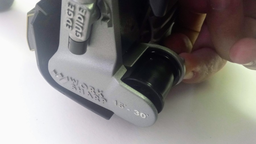 Push the spring-loaded belt change lever up 1. Push the spring-loaded belt change lever up 1.
