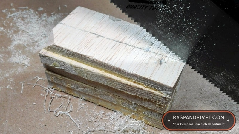 Starting a cross cut on a block of balsa wood with a standard backsaw. Starting a cross cut on a block of balsa wood with a standard backsaw.
