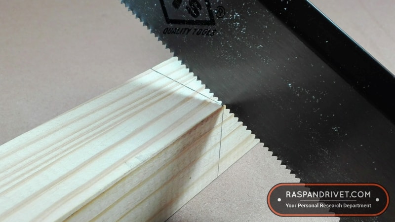 Starting a cross cut on pine wood with a standard backsaw. Starting a cross cut on pine wood with a standard backsaw.
