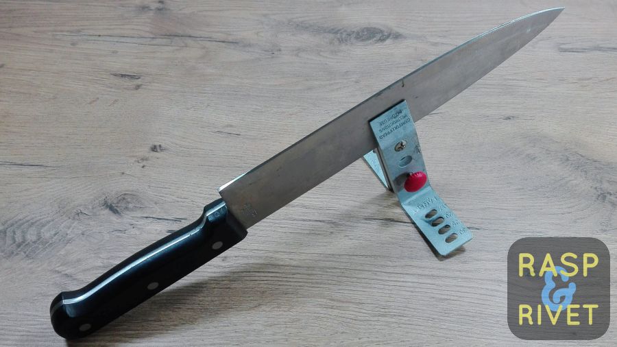 The Chef’s knife clamped in the Lansky ready to be sharpened. The Chef's knife clamped in the Lansky ready to be sharpened.