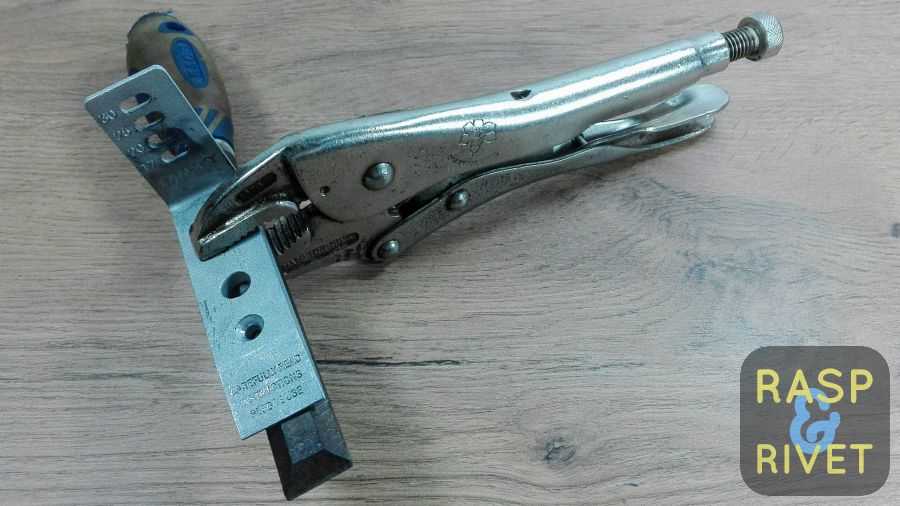 The chisel clamped to half of the Lansky clamp with a vice grip. The chisel clamped to half of the Lansky clamp with a vice grip.