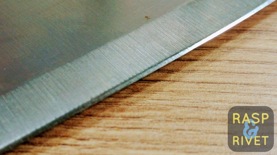 The meat cleaver’s other edge before sharpening with the Lansky. The meat cleaver's other edge before sharpening with the Lansky.
