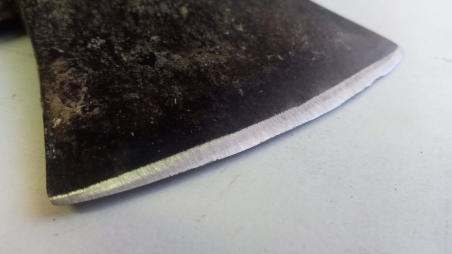 The other side of the ax after sharpening. The other side of the ax after sharpening.