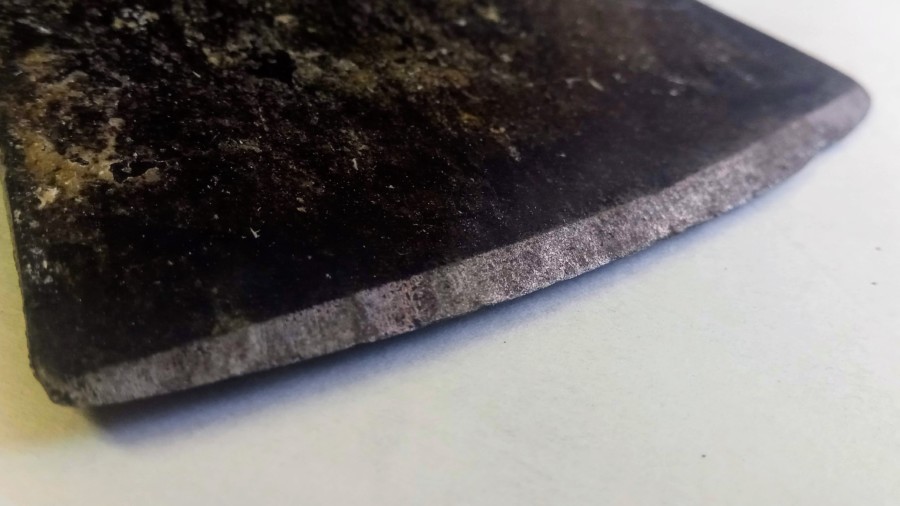 The other side of the ax before sharpening. The other side of the ax before sharpening.