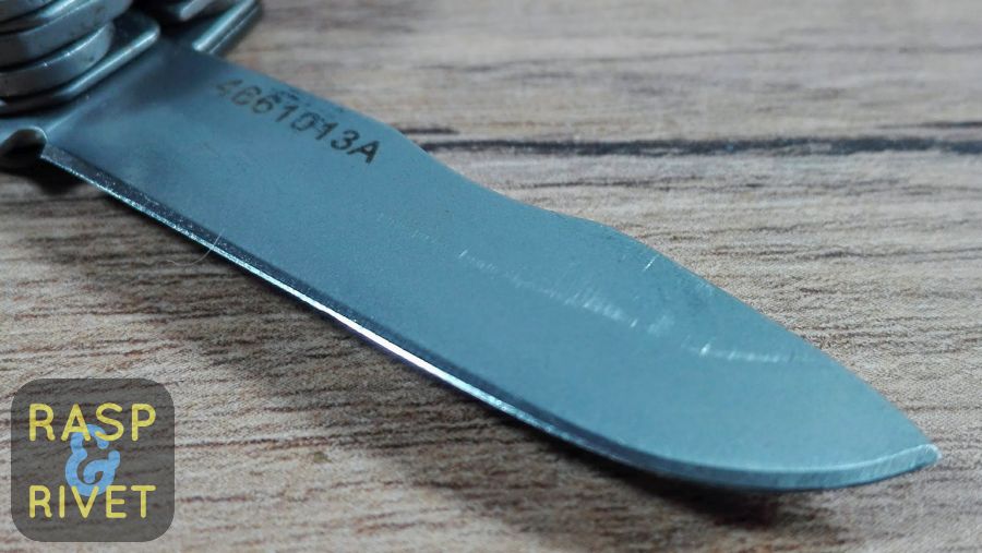 The other side of the Gerber Mini multi tool’s blade before sharpening with the Lansky. The other side of the Gerber Mini multi tool's blade before sharpening with the Lansky.