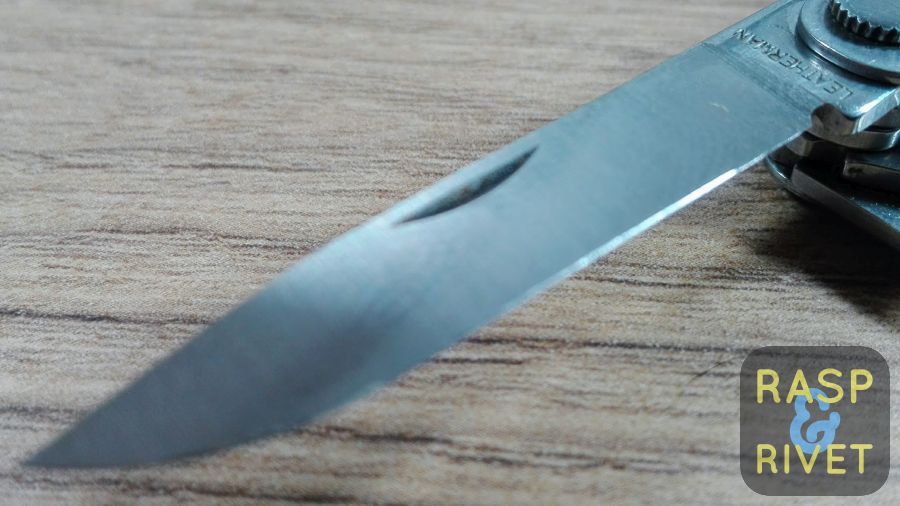 The other side of the Leatherman Micra’s blade before sharpening with the Lansky. The other side of the Leatherman Micra's blade before sharpening with the Lansky.