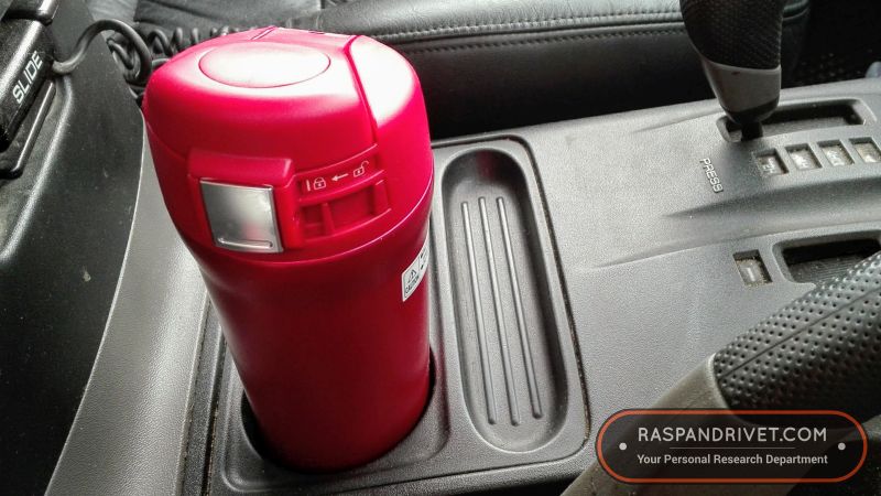 The Zojirushi inside a Mitsubishi Pajero’s cup holder. The Zojirushi inside a Mitsubishi Pajero's cup holder.