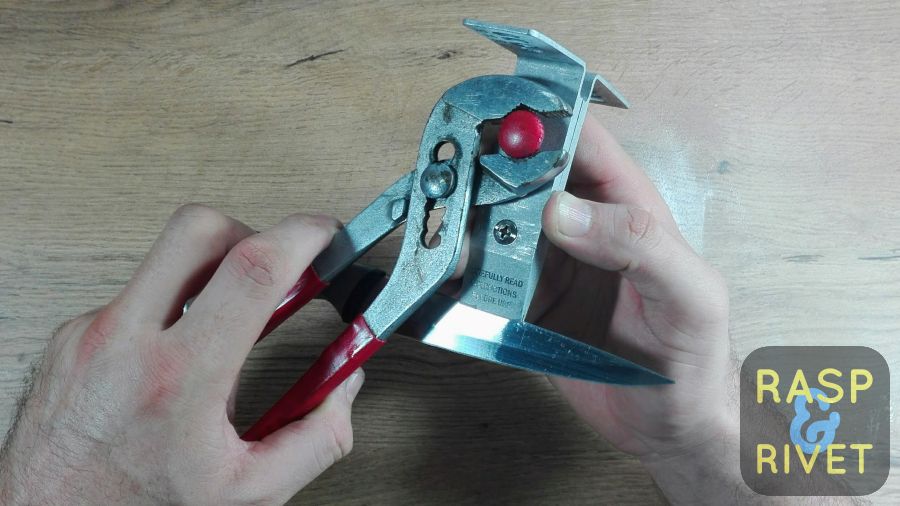 Tighten the knurl knob screw with a pair of pliers. Tighten the knurl knob screw with a pair of pliers.