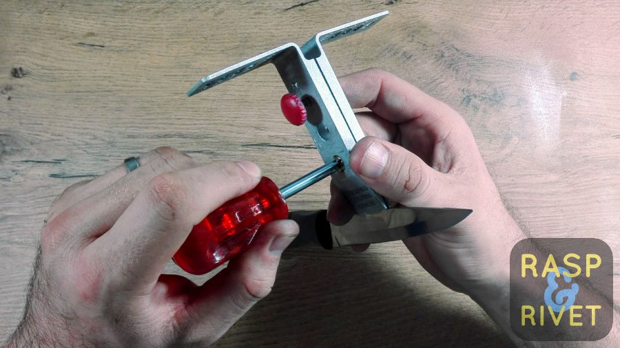 Tighten the phillips screw. Tighten the phillips screw.