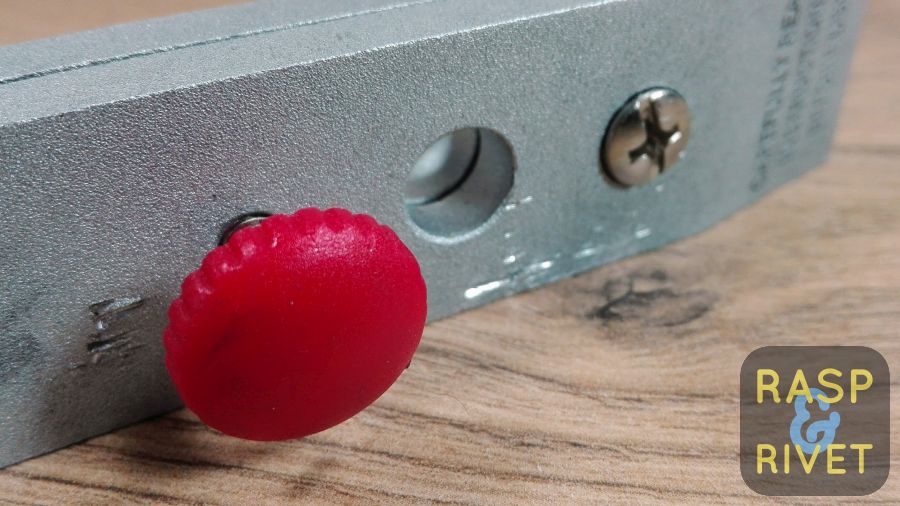 Tighten the red-headed screw with a pair of pliers to prevent a blade from moving while clamped in the Lansky. Tighten the red-headed screw with a pair of pliers to prevent a blade from moving while clamped in the Lansky.